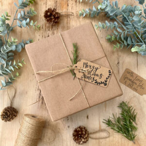 Gift wrapping with handwritten personalised gift tag in calligraphy style writing