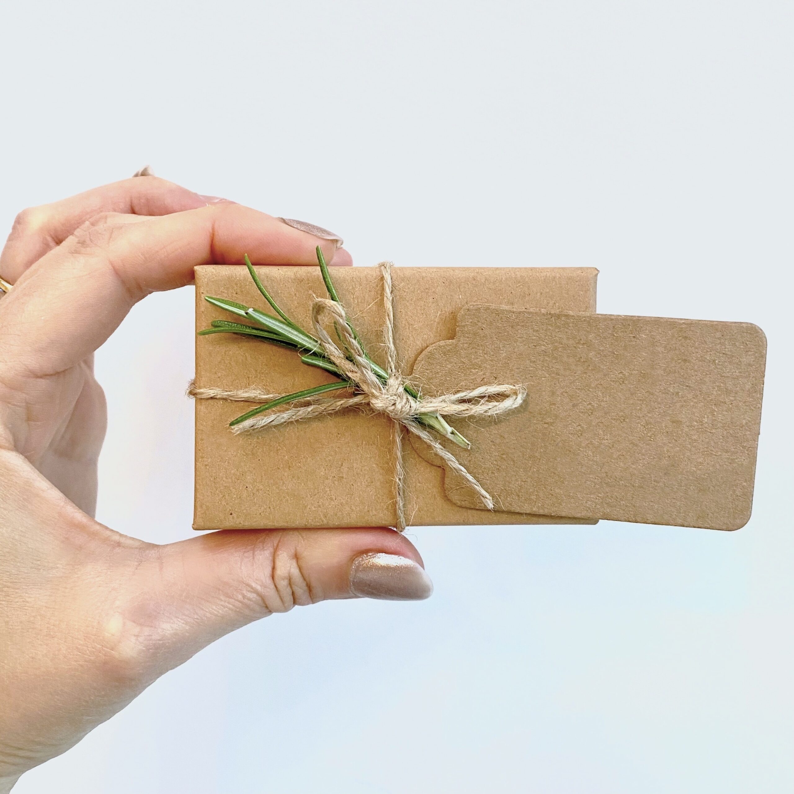 Plain gift tag, twine with fresh rosemary
